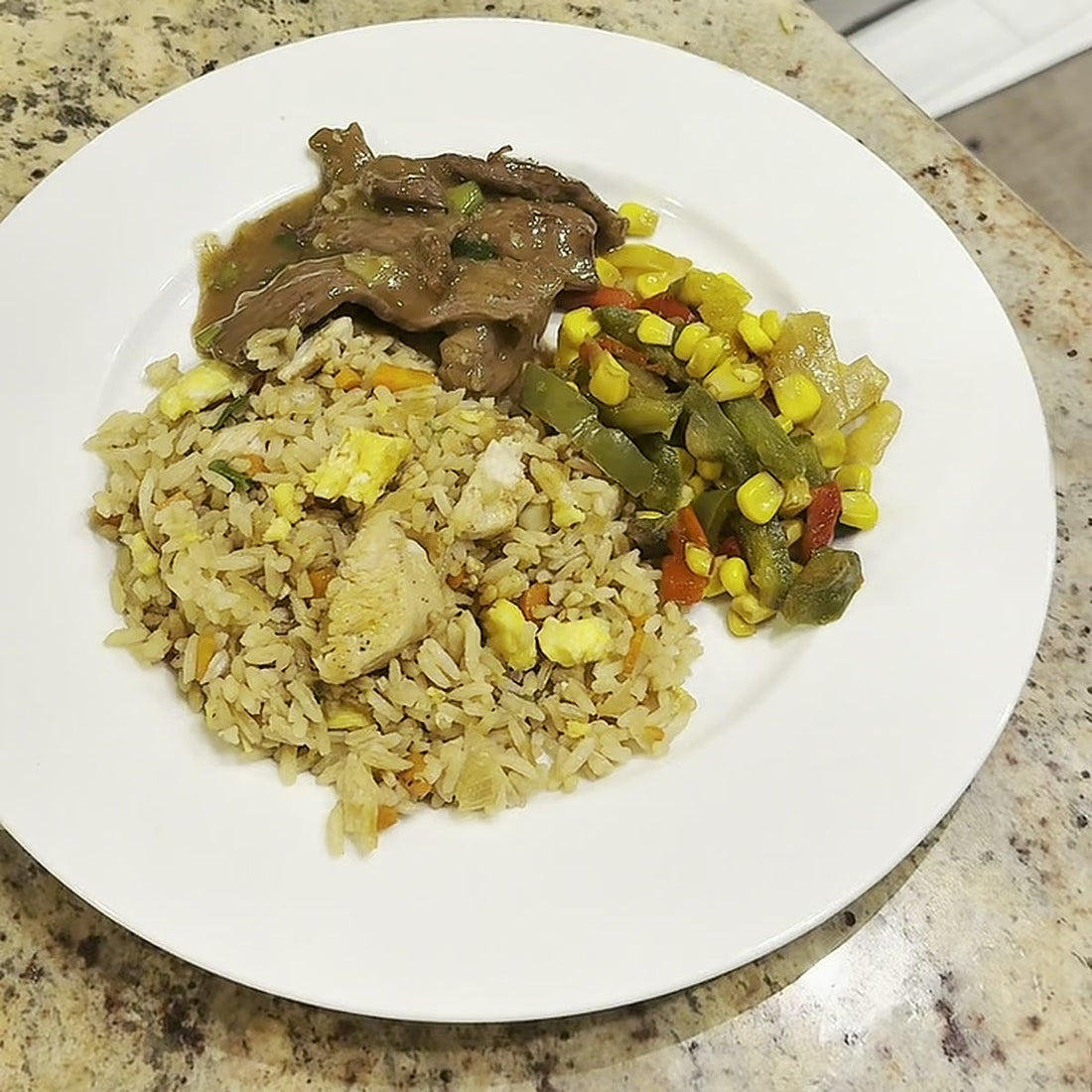 Arroz frito cubano, Cuban Chinese fried rice, plated with bistec in mushroom sauce and mixed vegetables