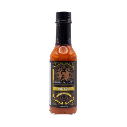 Bottle of Barbaro Mojo Piñazo Cuban hot sauce, front label, on a white background