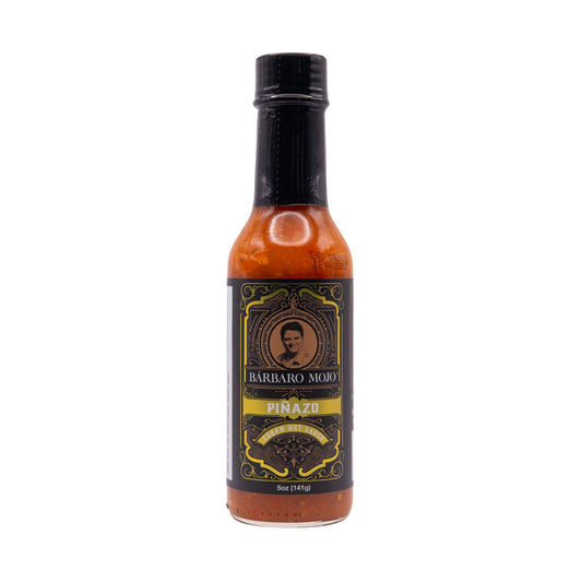 Bottle of Barbaro Mojo Piñazo Cuban hot sauce, front label, on a white background